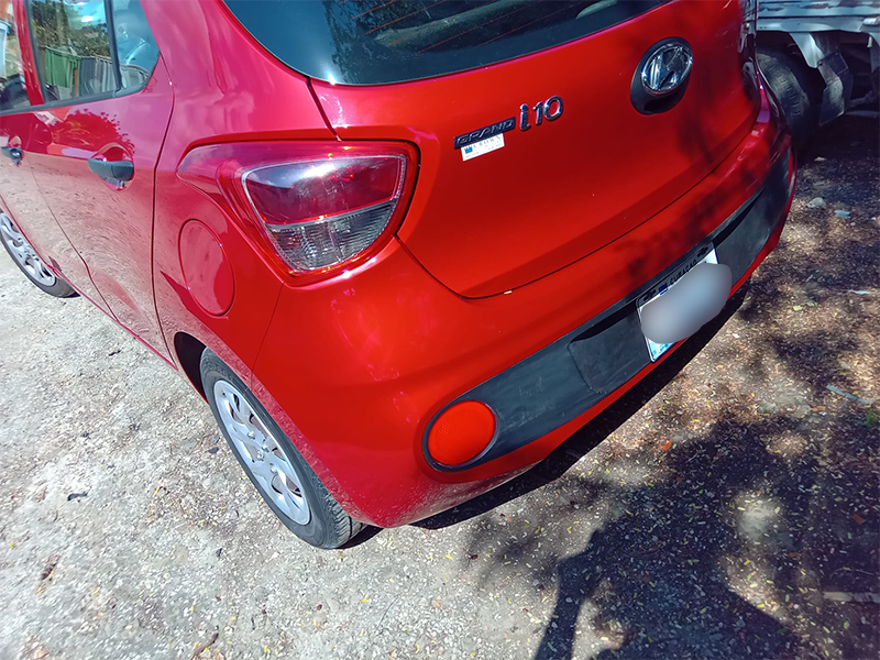 Red Hyundai i10 with the rear left panel fully repaired and color-match painted.
