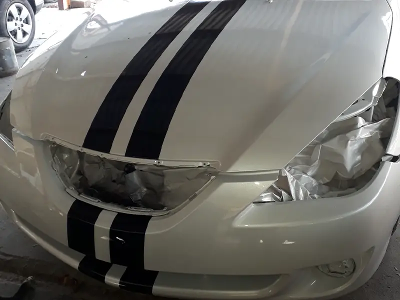 Auto after makeover, now white with black stripe details.
