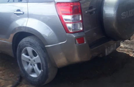 Restored silver SUV rear bumper after professional collision repair and paint matching. Garage G&G.